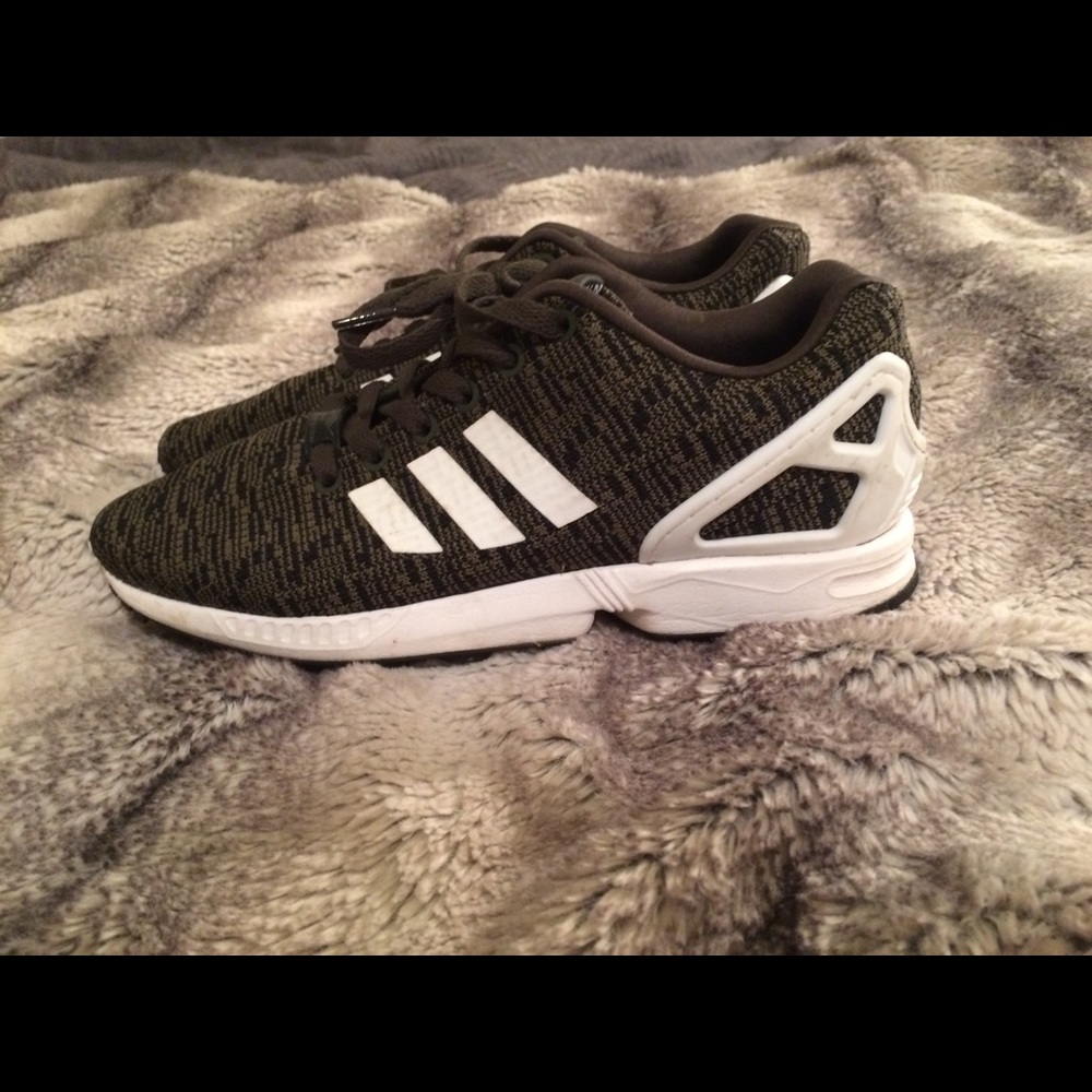 Green adidas running shoes lightly worn